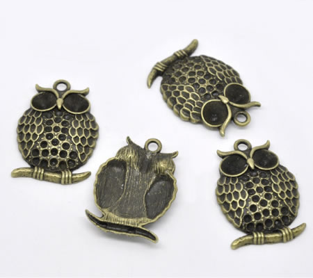 1x Bronzen Bedel Uil